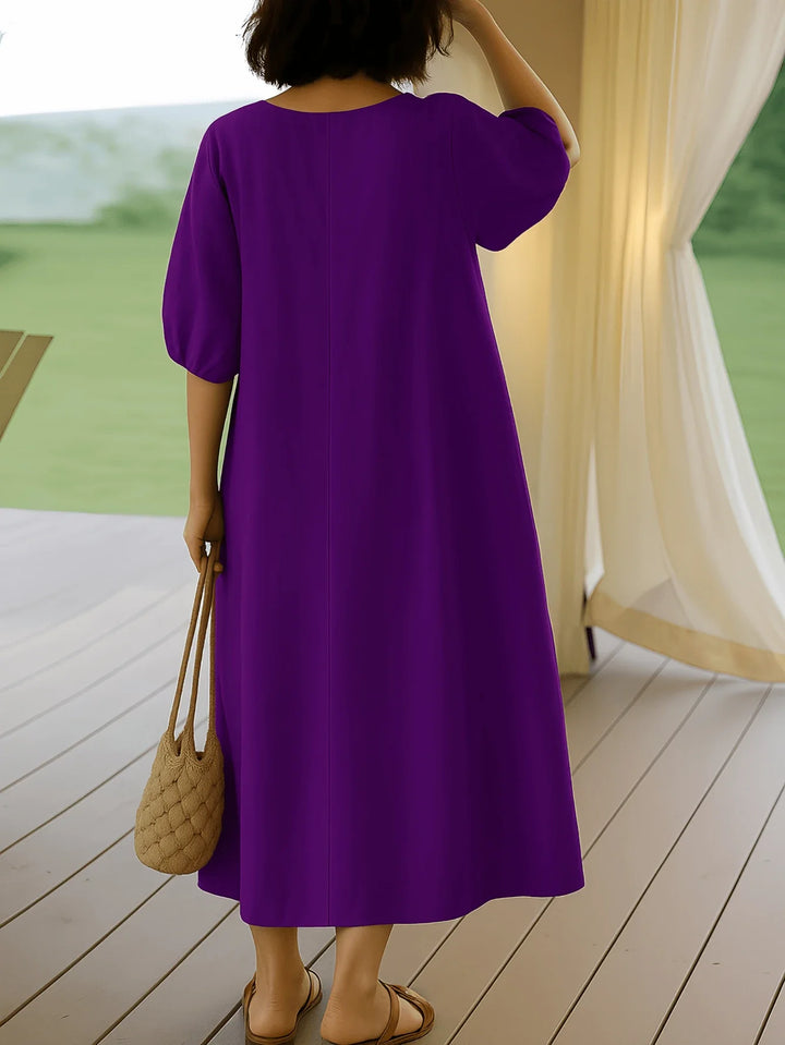 Vestido de dama hasta la mitad de la pantorrilla con mangas abullonadas